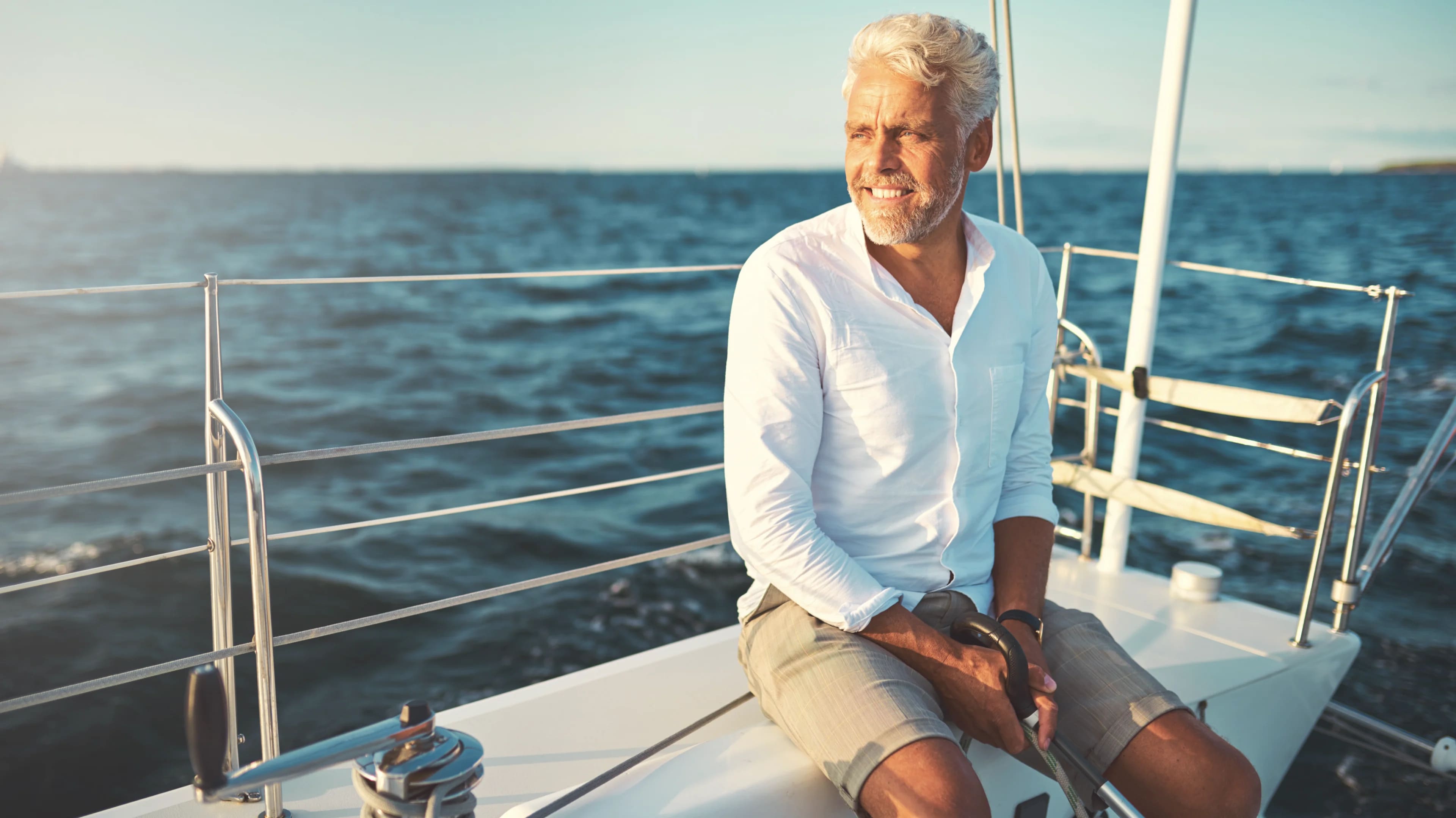 SmilingGrandpa_OnBoatBySea